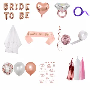 Detailed flat lay of rose gold Bride to Be party kit with balloons and accessories
