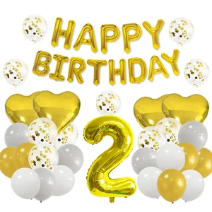 Detail of 2nd birthday gold party set with metallic foil balloons and sequin latex balloons