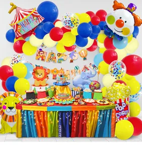 Circus party decor with clown, popcorn balloons, banner and lights for birthday setups