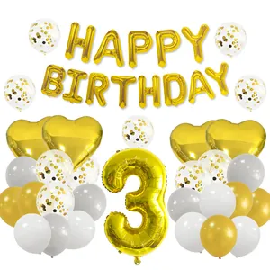 Detail of 3rd birthday balloon set with golden number 3, heart foils, and confetti balloons