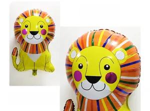 Detail of cute yellow lion foil balloon with colorful mane for circus birthday parties