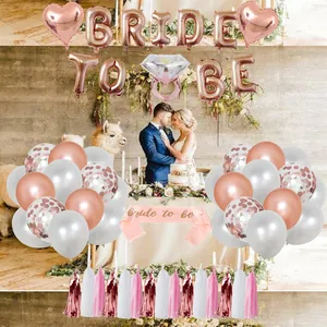 Rose gold Bride to Be party set with foil balloons, sash, and decorative tassels