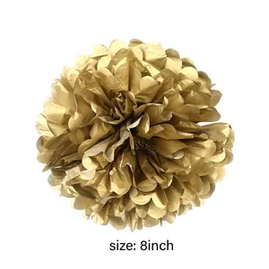 Detail of an 8-inch golden tissue paper pom pom flower for birthday party decorations