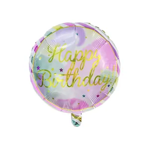 Detail of round foil birthday balloon with pastel watercolor design and gold lettering