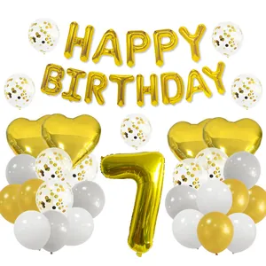 Detail set of golden 7th birthday balloons with metallic letters and confetti latex balloons
