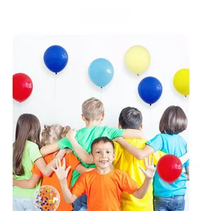 Kids celebrating with colorful circus theme latex and confetti balloons for birthday party