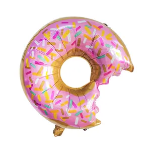 Pink donut foil balloon with colorful sprinkles and a bite mark for birthday party decor
