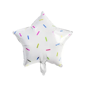 Macro shot of white star-shaped foil balloon with colorful sprinkles for party decor