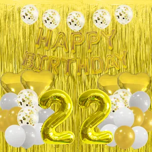 22nd birthday party set with gold fringe curtain, foil balloons and confetti latex balloons