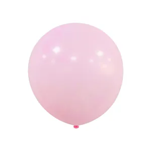 Detail of a light pink macaron latex balloon with a smooth reflective finish for party decor
