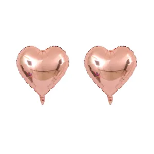Detail of heart-shaped rose gold foil balloons with metallic finish for bridal parties