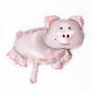 Detailed view of a pink polka dot pig shaped foil balloon for party decorations