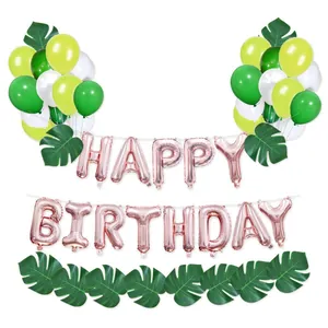 Kit fête jungle avec ballons Happy Birthday or rose et feuilles de palmier vertes