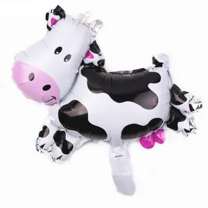 Detail of a 16-inch cow shaped foil balloon with black and white spots for party decor