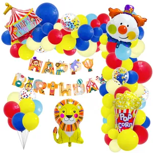 Circus themed birthday party set with balloons, clown, lion, tent and birthday banner