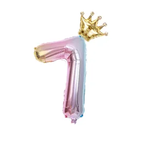 Close-up of number 7 foil balloon with gradient colors and a golden crown topper
