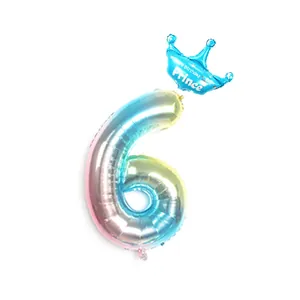 Detail of gradient rainbow number 6 foil balloon with blue crown for birthday party