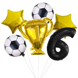 Detail of football 6th birthday set with champion trophy and star balloons