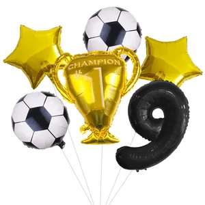 Macro shot of 9th birthday soccer balloon set including champion trophy and foil stars