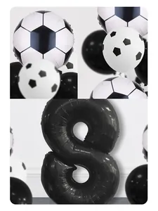 Detail of football party kit with metallic number eight and soccer pattern balloons