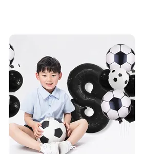 Detail of soccer themed party balloon set with black and white soccer foils and number 8