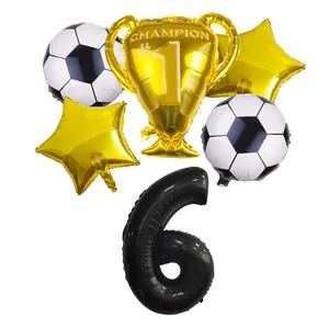 Detail view of soccer party balloon set with number 6, golden trophy and star balloons