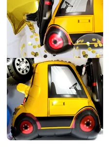 Detail view of yellow excavator foil balloon with golden stars for construction theme party
