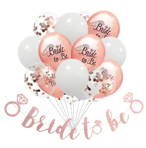 Detail of rose gold Bride to Be balloons and glitter banner set for wedding party decor