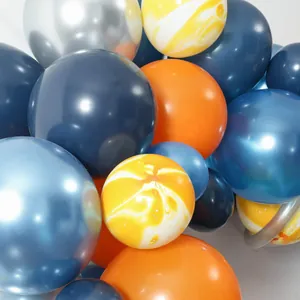 Detail of metallic blue, orange, and marble balloons for astronaut themed party decoration