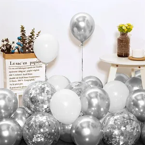Close-up of metallic silver and white balloons with silver confetti for party decor