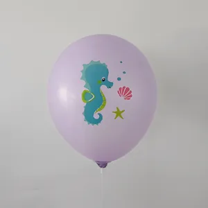 Detail of purple mermaid latex balloon with seahorse and starfish cartoon prints