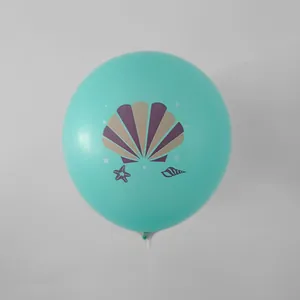 Detail view of a mint green mermaid themed balloon with shell and starfish patterns