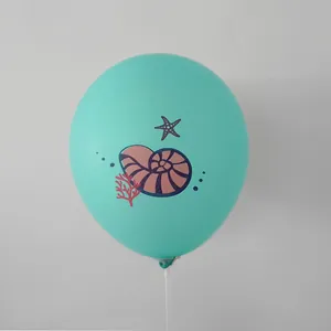 Detailed view of mint green latex balloon featuring purple seashell and starfish prints