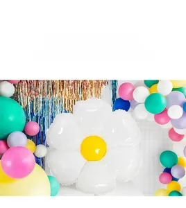 Detailed view of large white daisy foil balloon with colorful latex party balloons