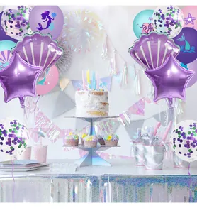 Detail of mermaid themed party balloon set with starfish prints and shell foil balloons