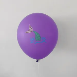 Detail of 12-inch purple mermaid balloon with teal scales and cartoon ocean prints