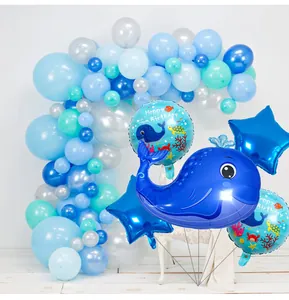 Macro detail of whale theme birthday balloon arch with ocean animal foil balloons