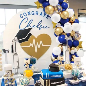 Navy blue and gold balloon arch kit with metallic star balloons for graduation party decor