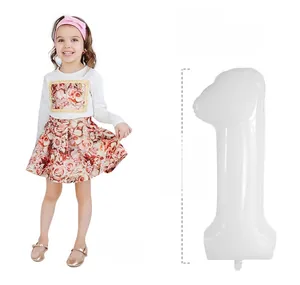 Detail of white 40 inch number 1 foil balloon showing 104cm height for first birthdays