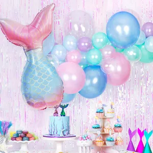 Close-up of a mermaid tail foil balloon with pink blue gradient and gold scales detail