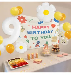 Daisy flower themed 9th birthday party decor with white number 9 balloon and banner