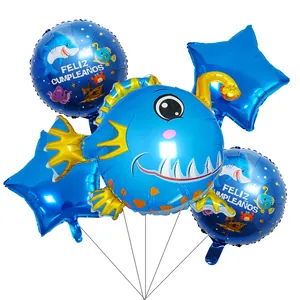Ocean themed balloon set with blue fish star and Feliz Cumpleaños round foil balloons