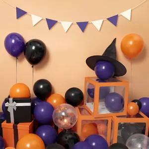 Halloween balloon arch kit with orange, black and purple balloons, boxes and wizard hat