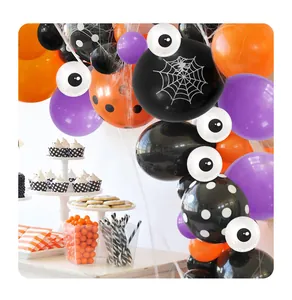 Halloween balloon arch detail with spider web patterns and orange purple latex balloons