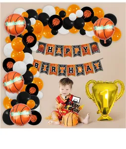 Detail of basketball themed birthday party kit with balloons, trophy and cake topper