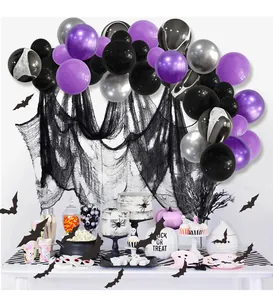 Detailed Halloween balloon arch with marble texture, bat cutouts and black mesh fabric
