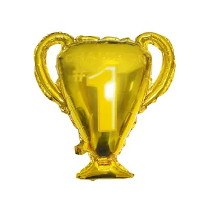 Detailed view of a golden trophy-shaped foil balloon with Champion and #1 printing