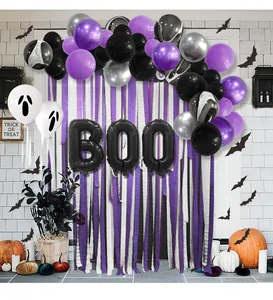 Halloween party scene with purple balloons, black bats, and BOO letter balloon decor