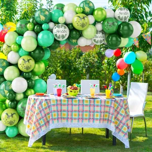 Dinosaur birthday party balloon arch kit with jungle theme prints and green latex balloons