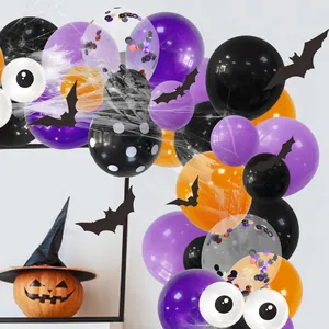 Halloween arch kit detail with purple black orange balloons bats and faux spider webs